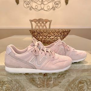 New Balance pale pink sneakers.